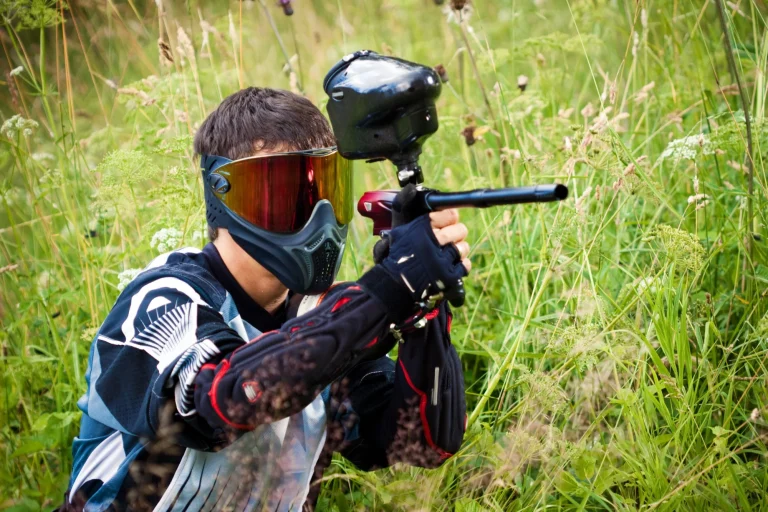 paintball shooter aiming the gun